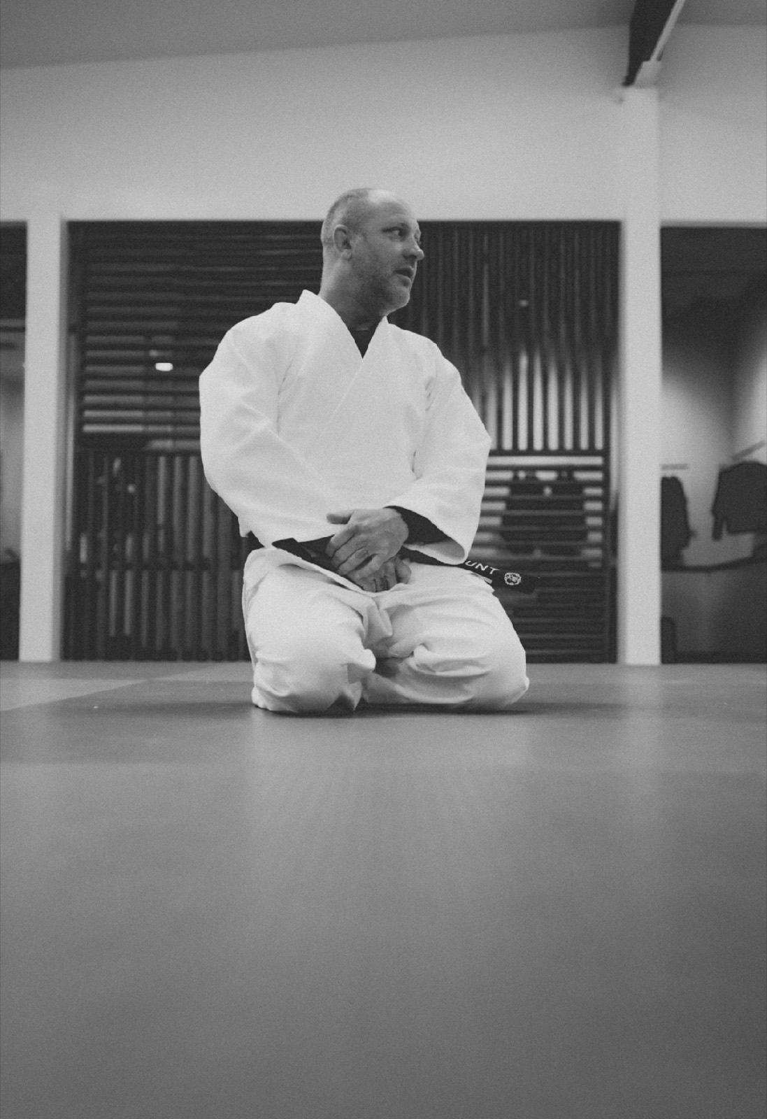 Jason Hunt kneeling on the mat
